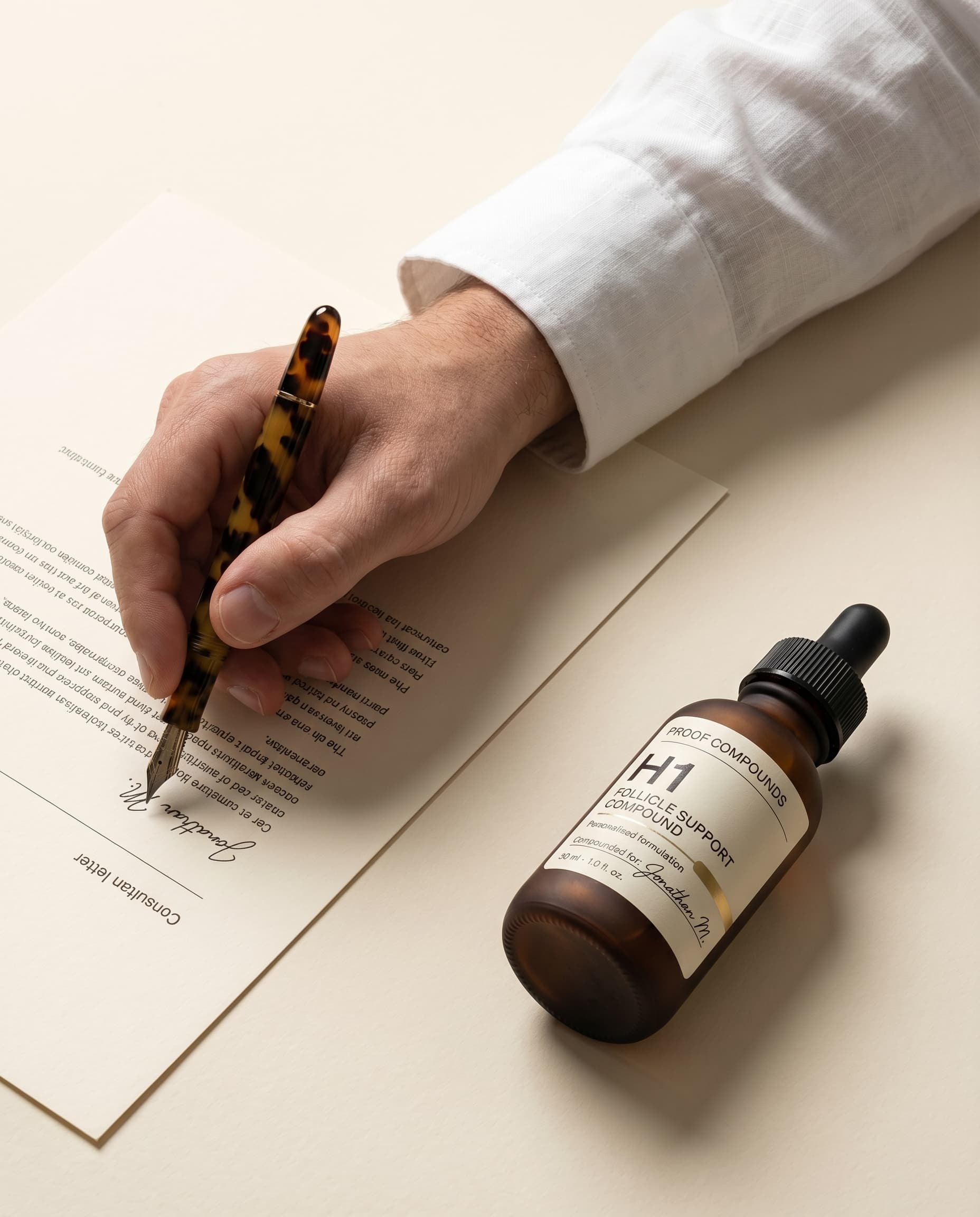 Physician hand signing consultation letter